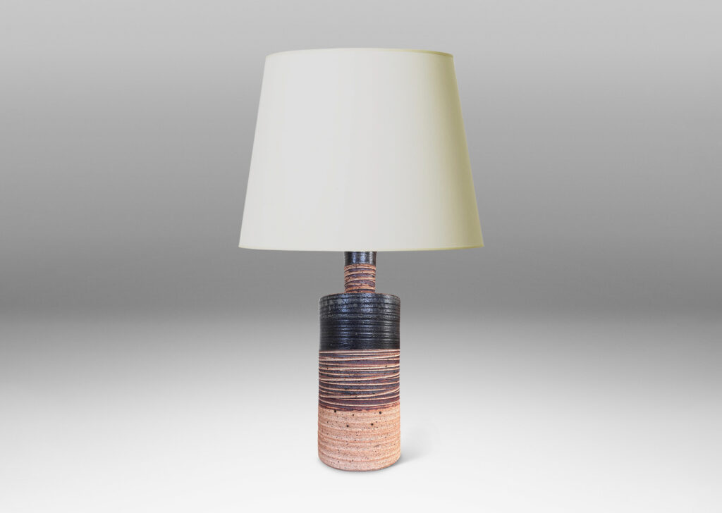 Gallery BAC slant-sided cylindrical forms with impressed texture and sprouting necks, glazed in shiny white and matte brown