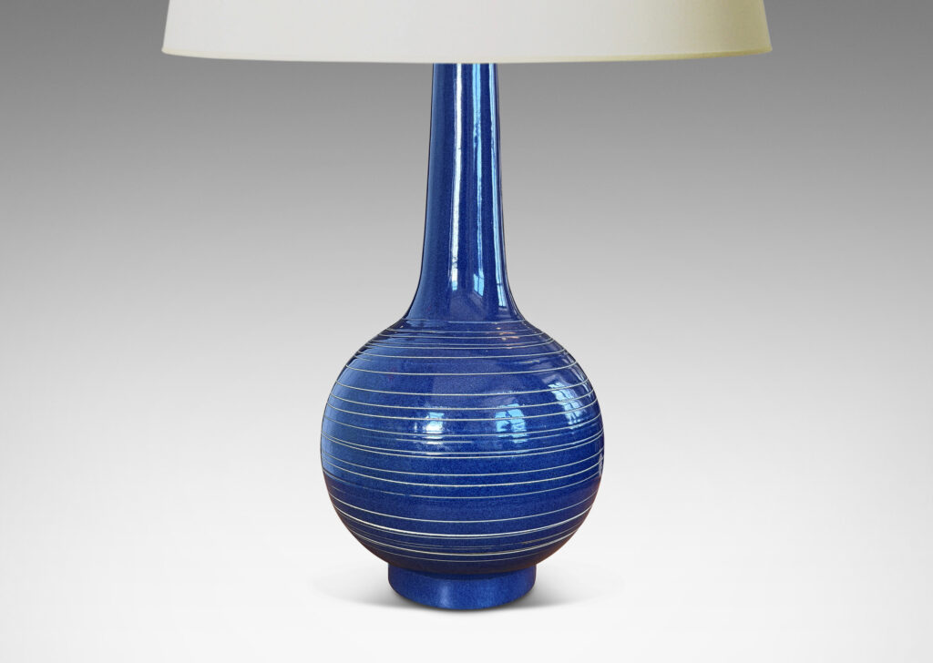 Gallery BAC globe body and tall neck, glazed in a deep blue with encircling sgraffito pinstripes