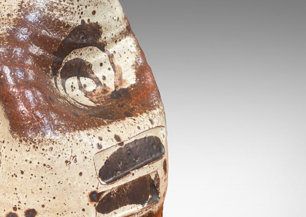 Gallery BAC beehive-like form pressed in on four sides, brushily glazed in pale gray with abstract motifs in dark brown