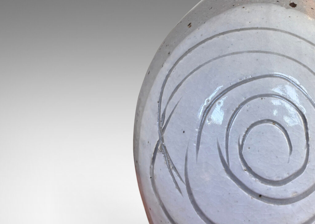 Gallery BAC half ovoid gumdrop form with sprouting neck, partially glazed in medium and light gray with sgraffito spirals