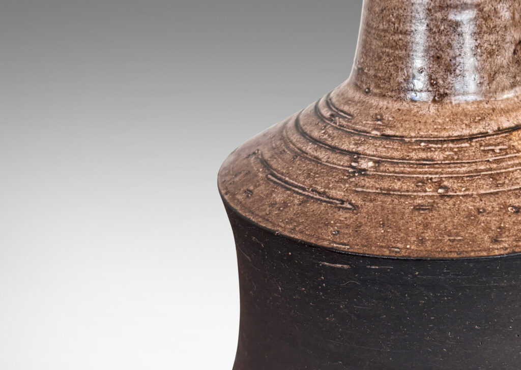 Gallery BAC cove-sided drum forms in a dark matte brown, with angled top and reveal glazed in a semi-shiny light brown