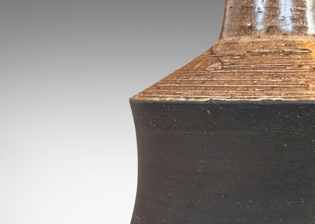 Gallery BAC cove-sided drum forms in a dark matte brown, with angled top and reveal glazed in a semi-shiny light brown