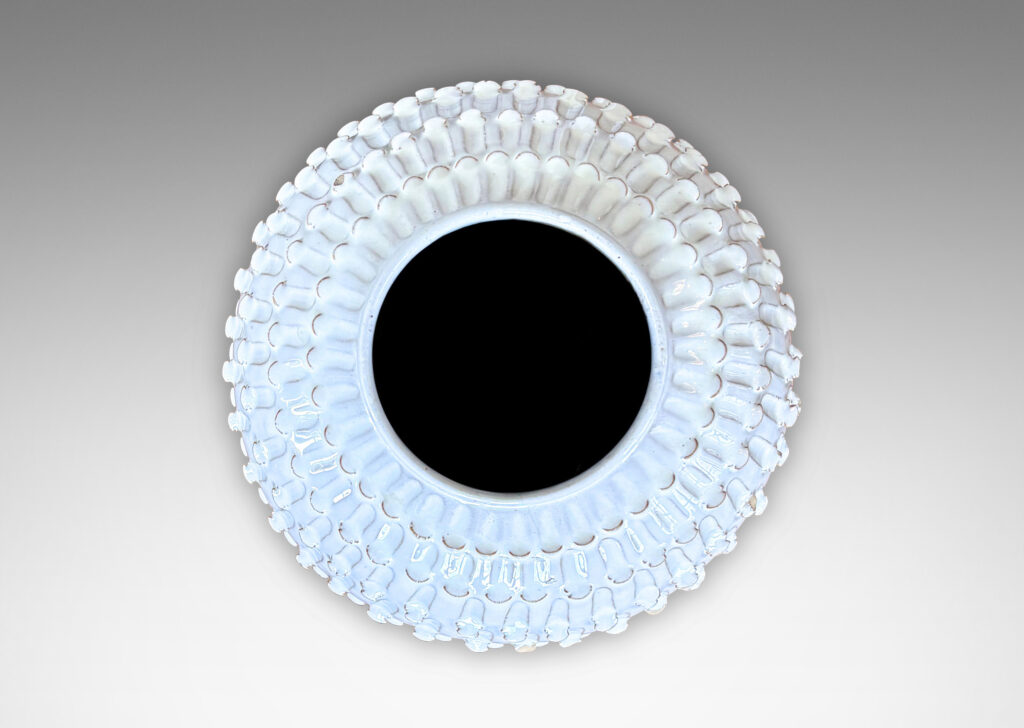 Gallery BAC wide, tapered form encircled in rows of carved strikes, glazed in glossy white