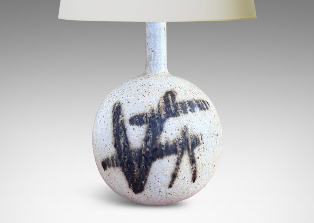Gallery BAC globe form with slender neck, glazed in a matte speckled pale gray, with abstract design in dark brown