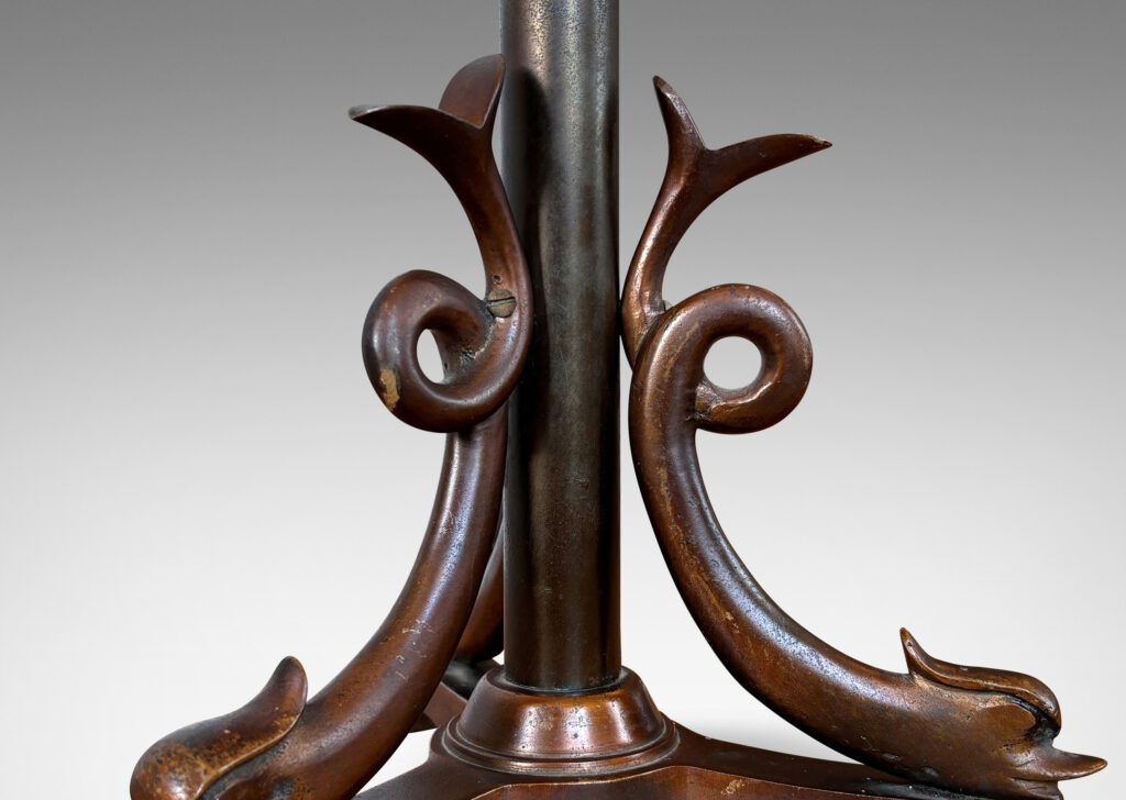 Gallery BAC tripod base with braces in the form of dolphins with lopped tails; cast bronze