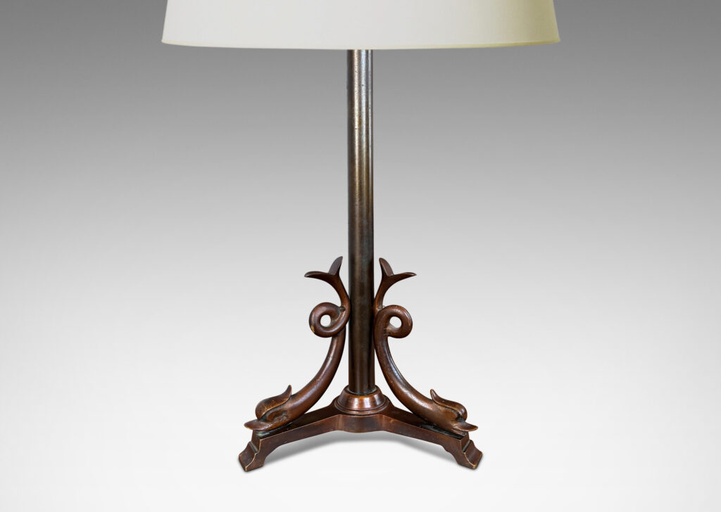 Gallery BAC tripod base with braces in the form of dolphins with lopped tails; cast bronze