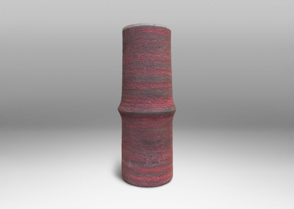 Gallery BAC cylindrical form with bamboo-like notch detail, glazed in matte brick red and brown, with an eggshell pale taupe interior