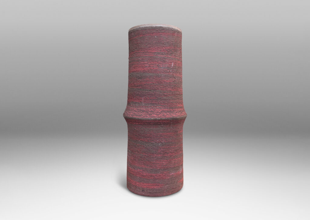Gallery BAC cylindrical form with bamboo-like notch detail, glazed in matte brick red and brown, with an eggshell pale taupe interior