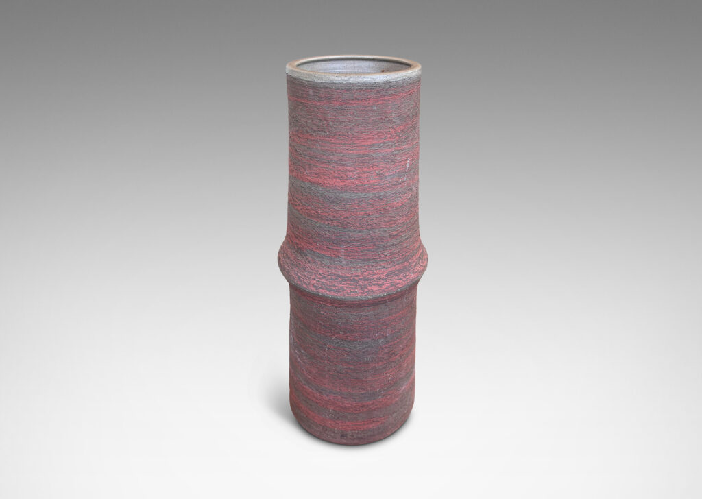 Gallery BAC cylindrical form with bamboo-like notch detail, glazed in matte brick red and brown, with an eggshell pale taupe interior