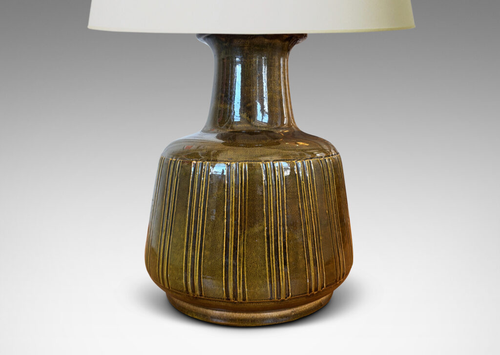 Gallery BAC angled drum form with carved vertical stripes and wide neck, glazed in yellow/gray