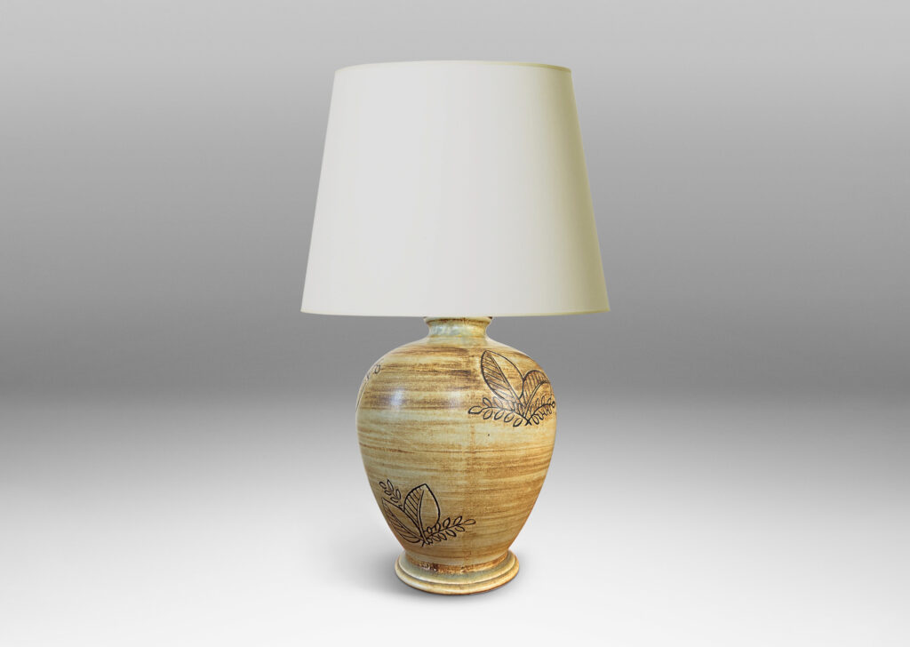 Gallery BAC traditional tapering form with plinth base and carved leafy motifs, glazed in a woodgrain-evoking matte striae brown over gold