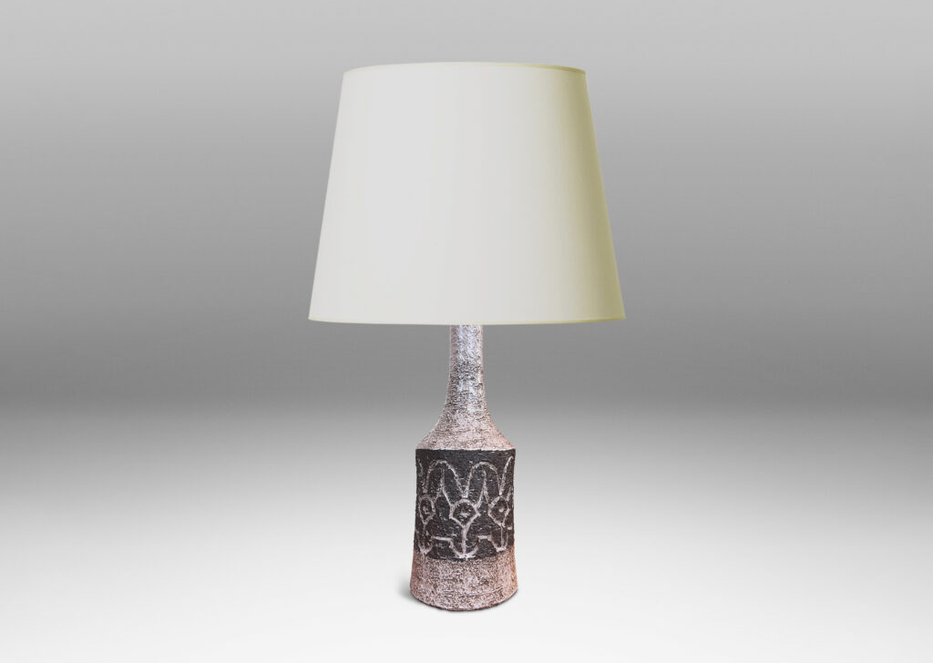 Gallery BAC bow-sided cylindrical form with carved abstract floral design and sprouting neck, glazed in pale taupe-gray and dark brown