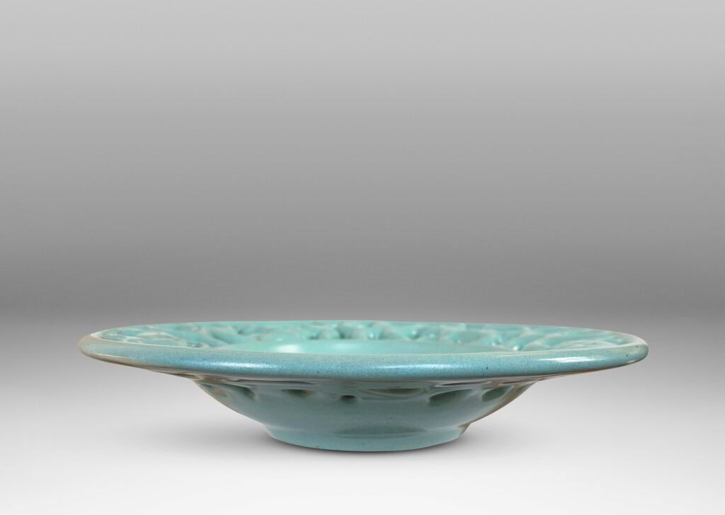Gallery BAC wide openwork rim with scrolls and animal figures, glazed in a pale turquoise