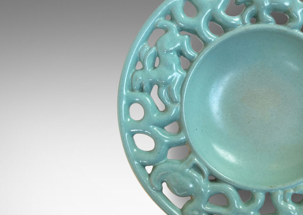 Gallery BAC wide openwork rim with scrolls and animal figures, glazed in a pale turquoise