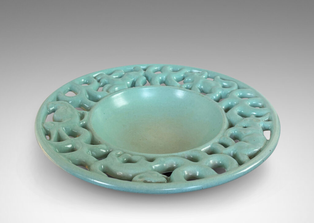 Gallery BAC wide openwork rim with scrolls and animal figures, glazed in a pale turquoise