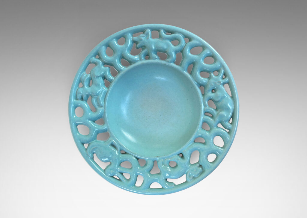 Gallery BAC wide openwork rim with scrolls and animal figures, glazed in a pale turquoise