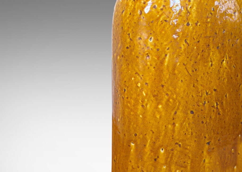 Gallery BAC rounded-shoulder flask form with grog texture and deep honey glaze