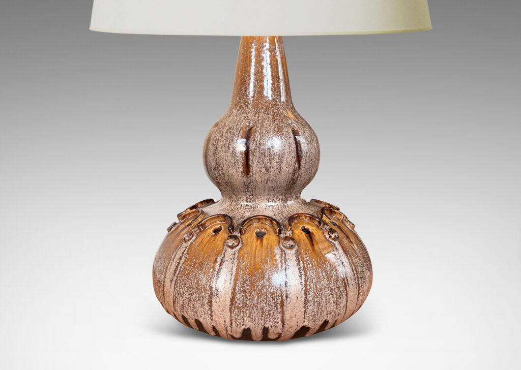 Gallery BAC dramatic double gourd form punctuated with impressed and relief geometric motifs, glazed in mocha brown with pale puce-taupe