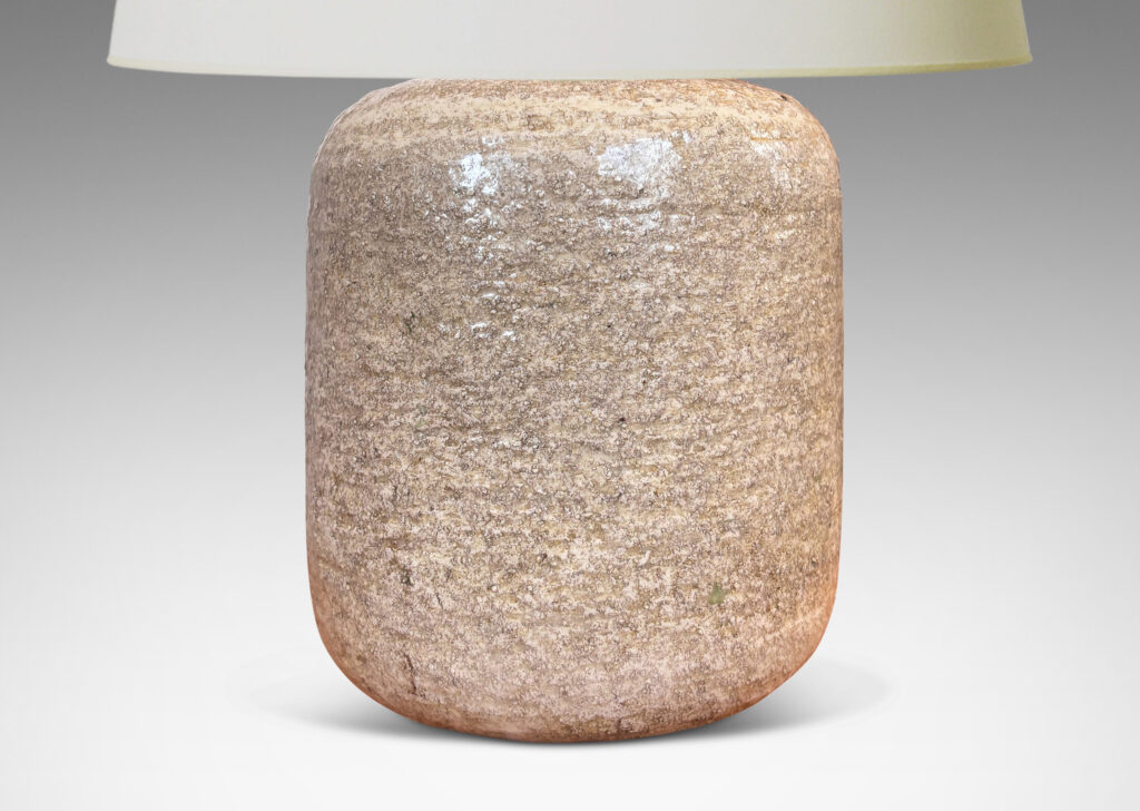 Gallery BAC rounded cylindrical form with textured surfacing, glazed in a pale sand tone with thin gray wash