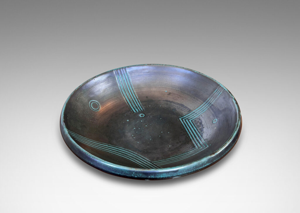Gallery BAC gently curved sides and relief striated geometric designs; tonal teal green copper oxide glazing