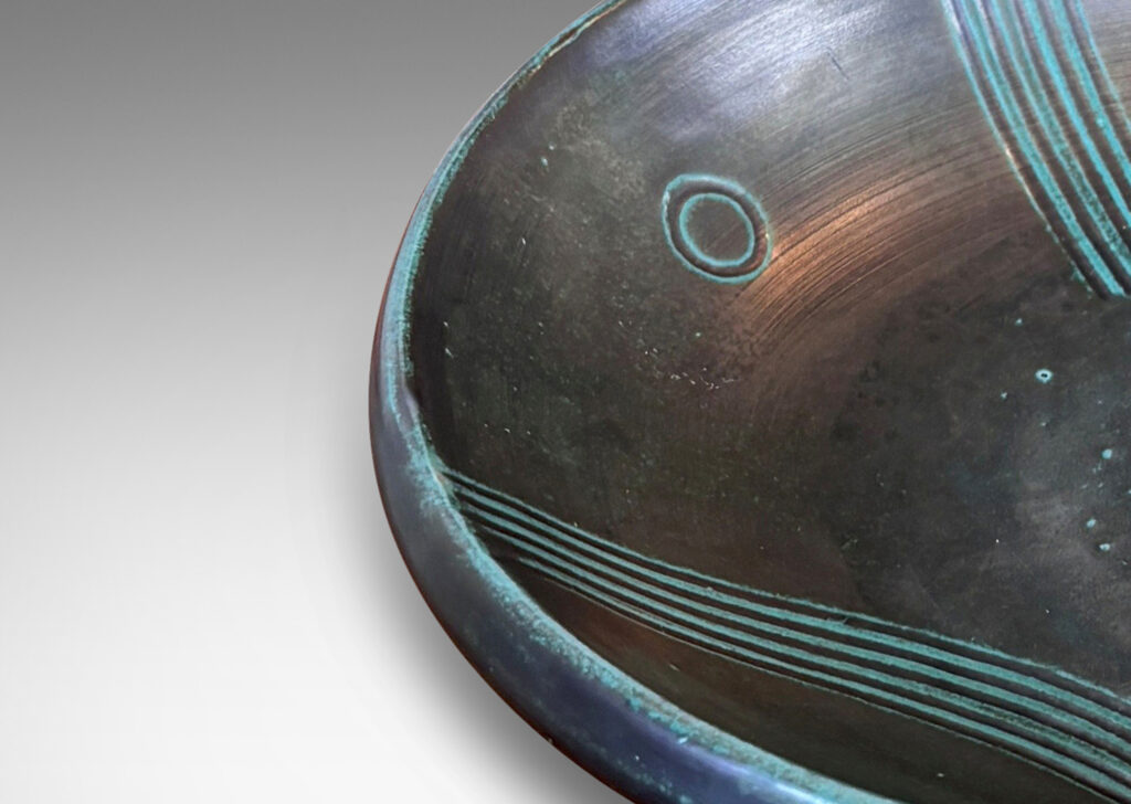 Gallery BAC gently curved sides and relief striated geometric designs; tonal teal green copper oxide glazing