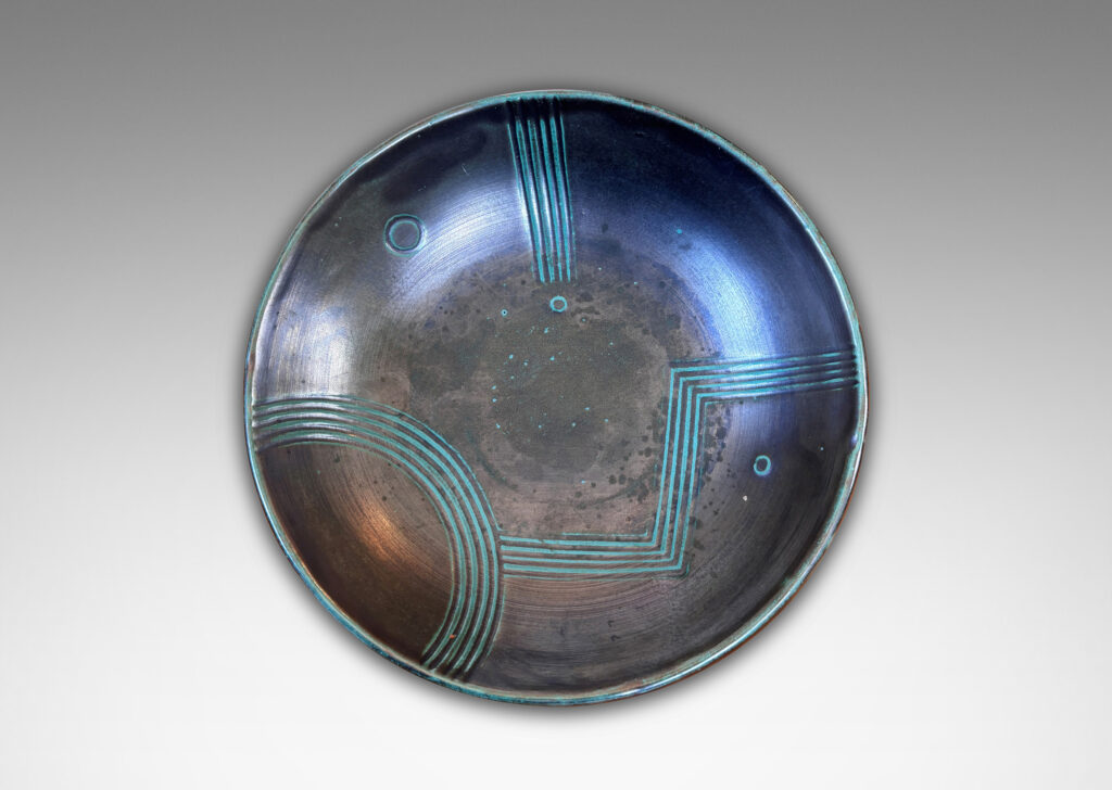 Gallery BAC gently curved sides and relief striated geometric designs; tonal teal green copper oxide glazing
