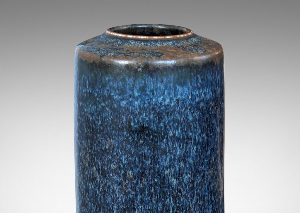 Gallery BAC tall cylindrical form with flush mouth, glazed in black-dark gray and brown