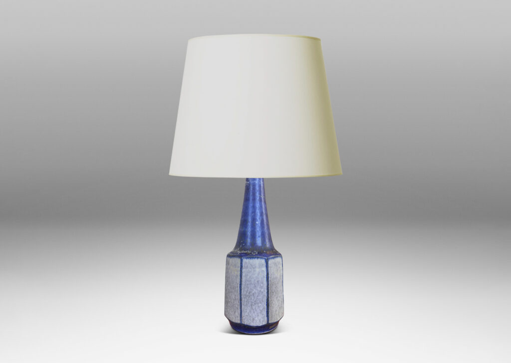 Gallery BAC octagonally faceted cylinder form with conical neck, glazed in dark cornflower blue and pale gray