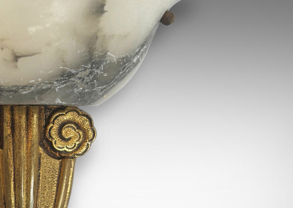 Gallery BAC mounts ornamented with stylized flora and bell-form shades; gilded metal and alabaster