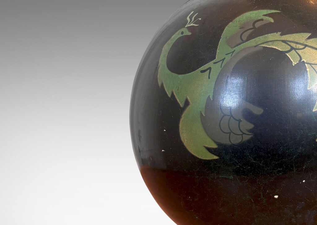 Gallery BAC globe form with a painted black finish with floating phoenix motifs in green tones; wood