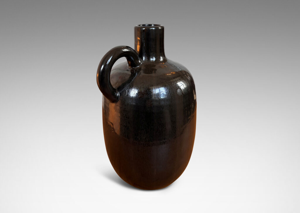 Gallery BAC upright ovoid form with carved pinstripe meridians, spouting neck, and arced handle