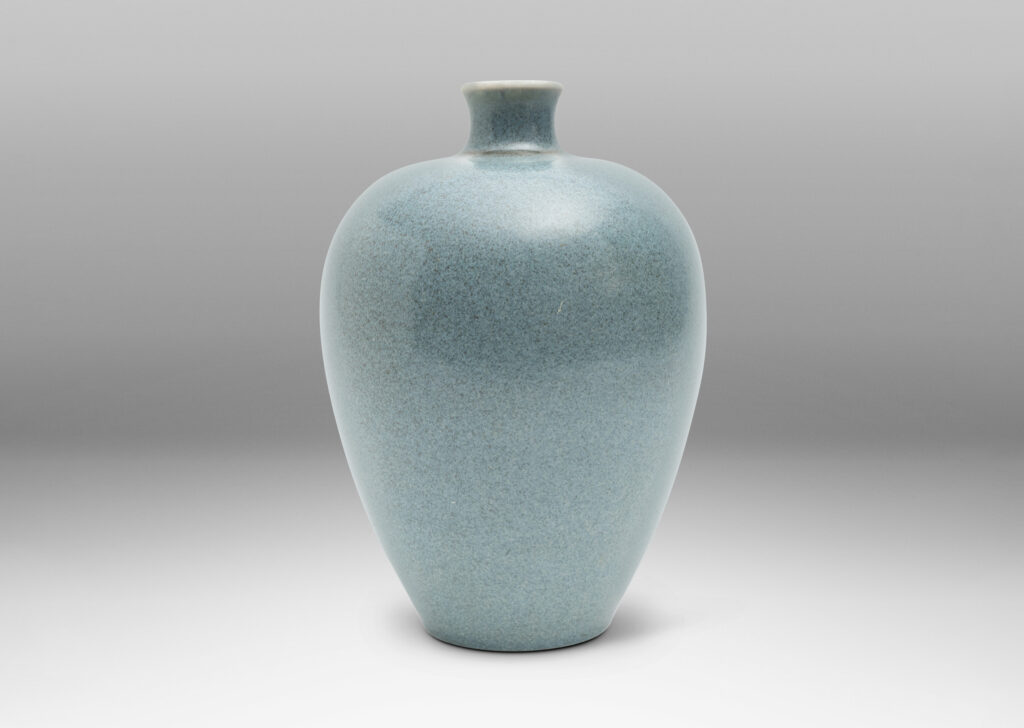 Gallery BAC tapered form with spouting mouth, glazed in a speckled light blue glaze