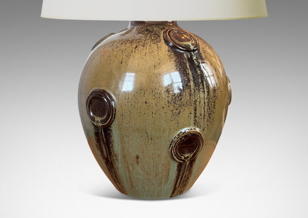 Gallery BAC balloon form with floating circular motifs in relief, glazed in olive green and brown tones