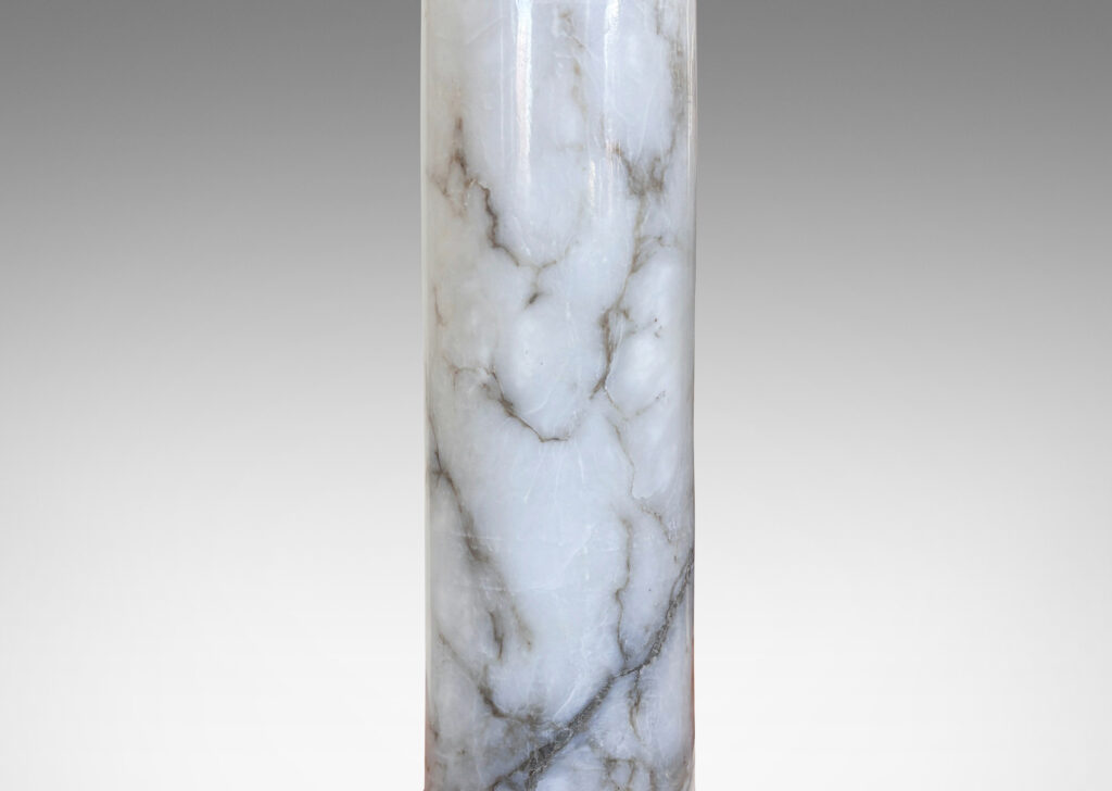 Gallery BAC slender cylindrical forms with bases articulated with relief rings, in cool white with gray veining