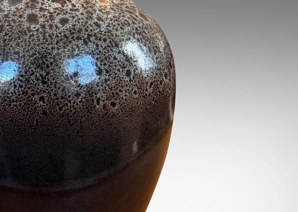 Gallery BAC tapered apple-like forms with wide necks, glazed in dark brown with mantles of lighter speckling