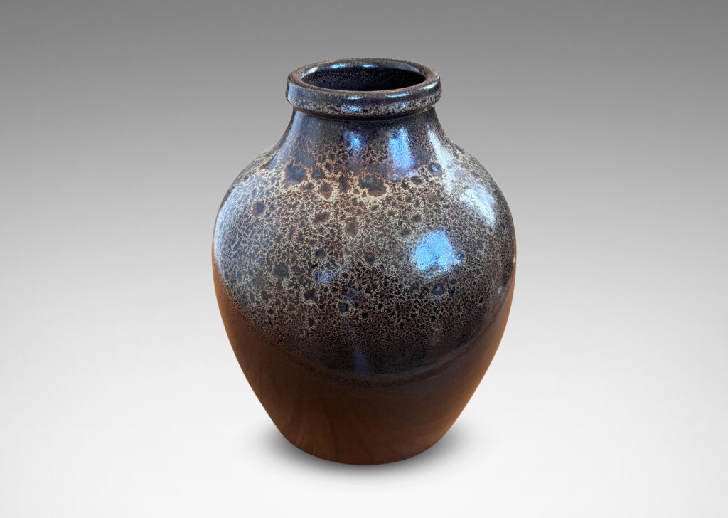 Gallery BAC tapered apple-like forms with wide necks, glazed in dark brown with mantles of lighter speckling