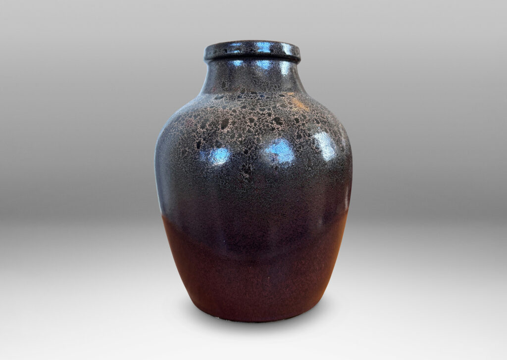 Gallery BAC tapered apple-like forms with wide necks, glazed in dark brown with mantles of lighter speckling
