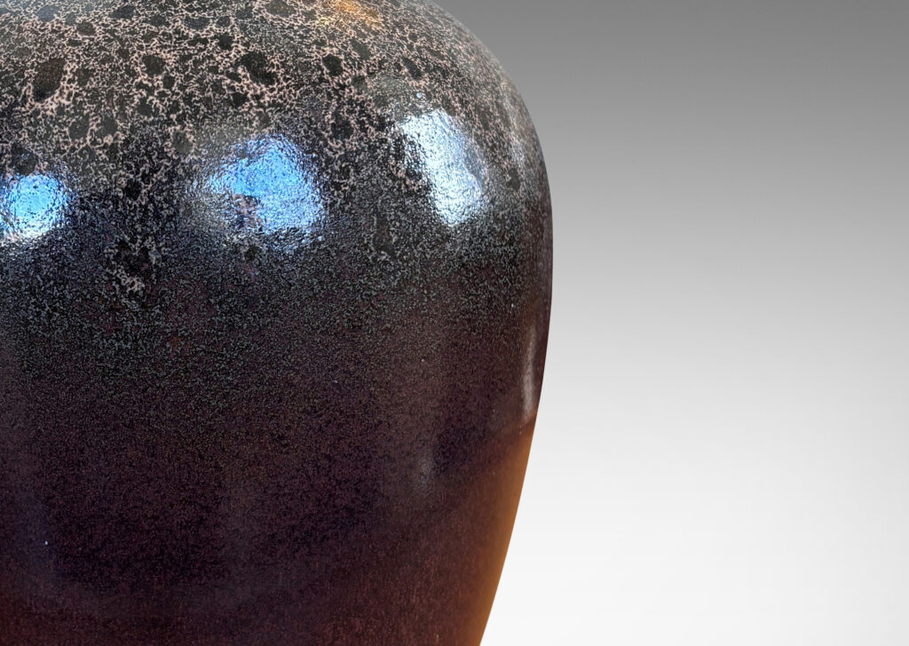Gallery BAC tapered apple-like forms with wide necks, glazed in dark brown with mantles of lighter speckling