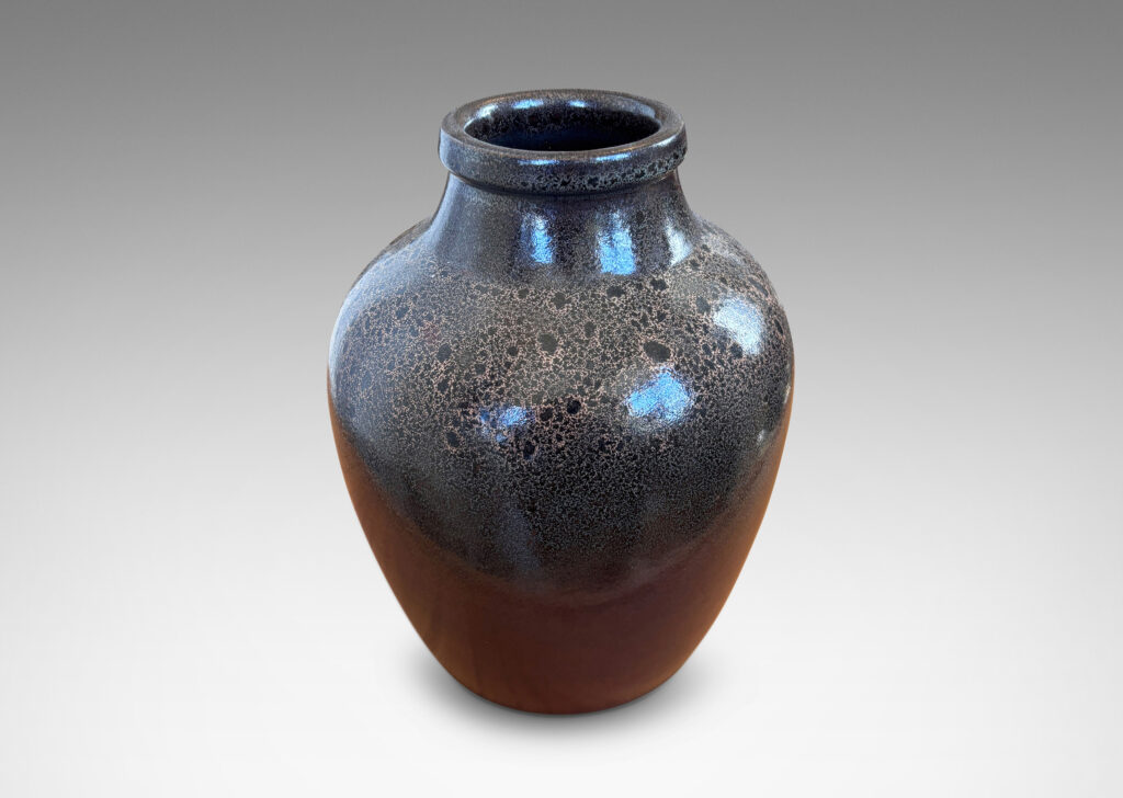 Gallery BAC tapered apple-like forms with wide necks, glazed in dark brown with mantles of lighter speckling