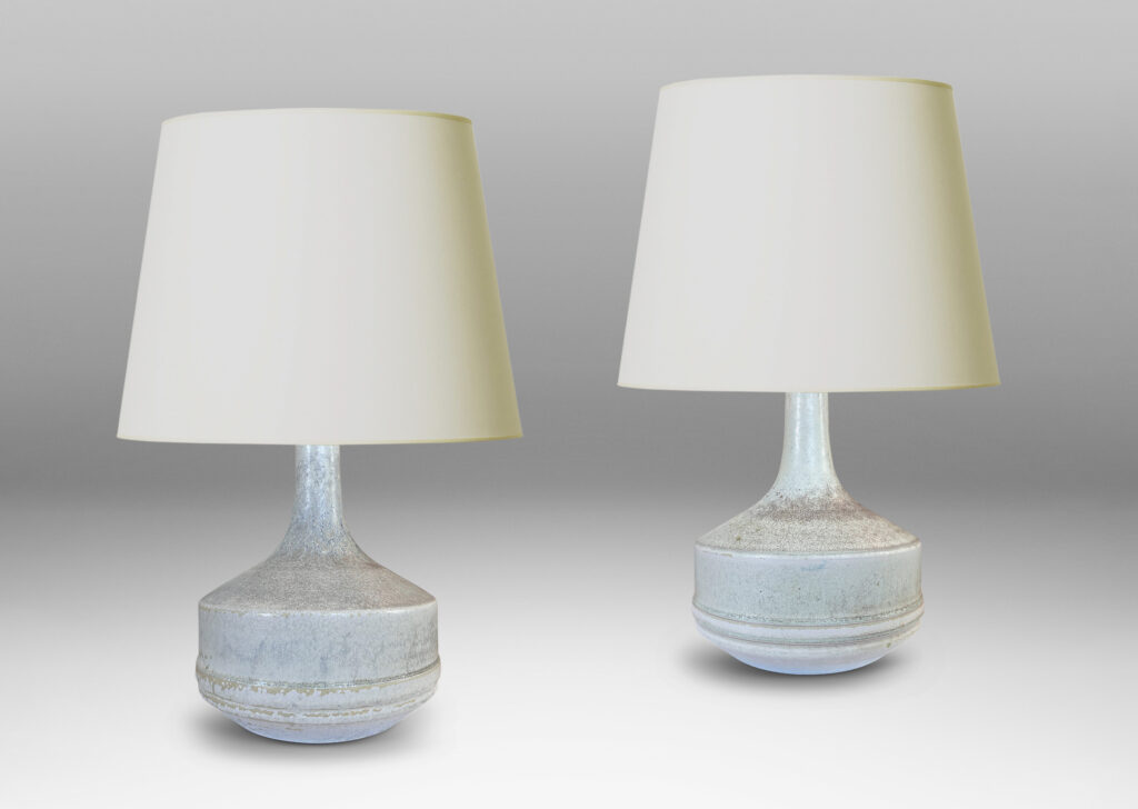 Gallery BAC low drum forms with sprouting tall necks, glazed in mottled very pale gray