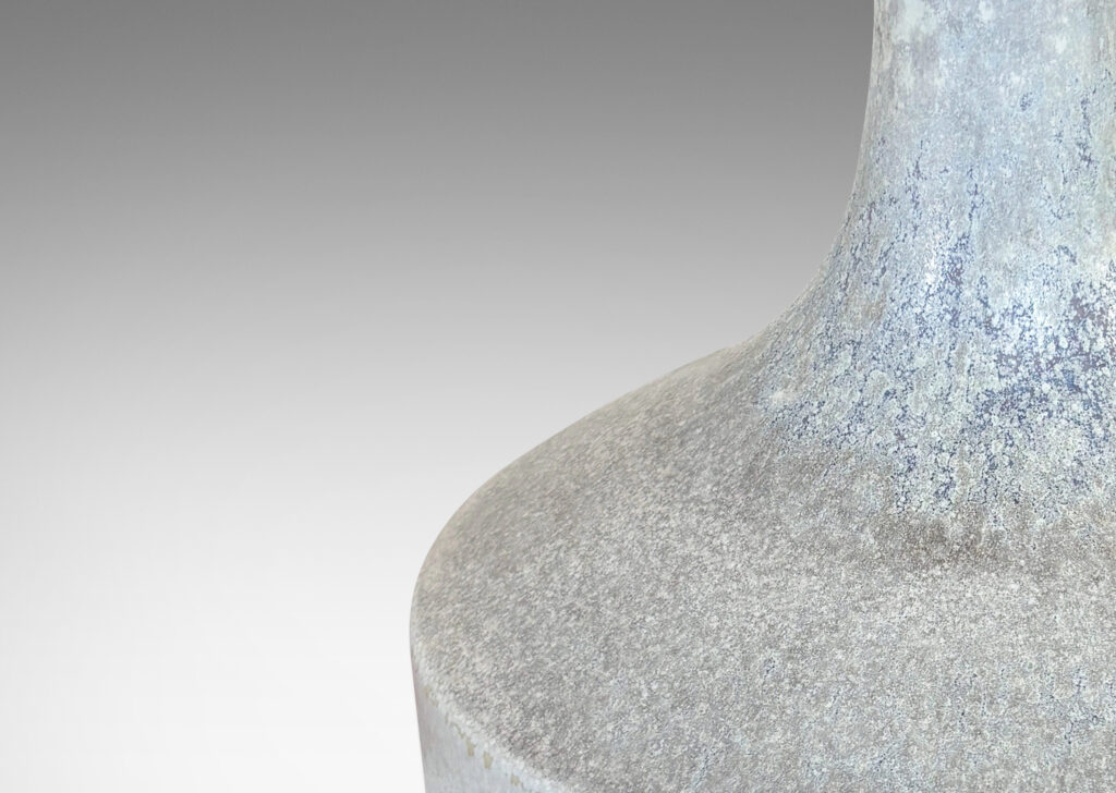 Gallery BAC low drum forms with sprouting tall necks, glazed in mottled very pale gray