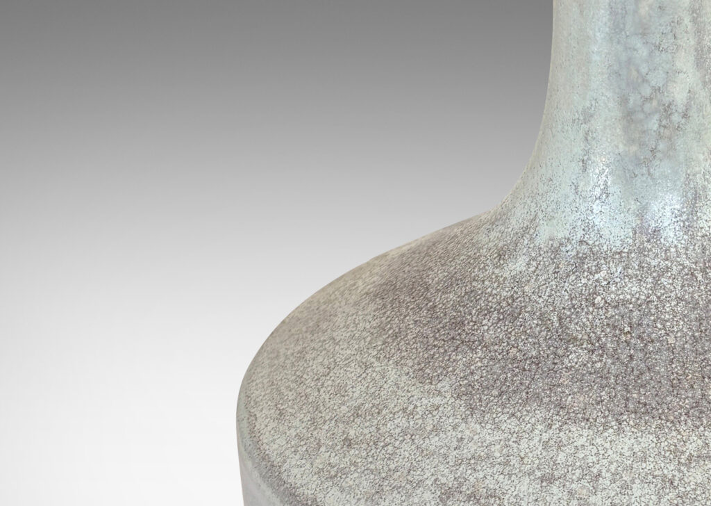 Gallery BAC low drum forms with sprouting tall necks, glazed in mottled very pale gray
