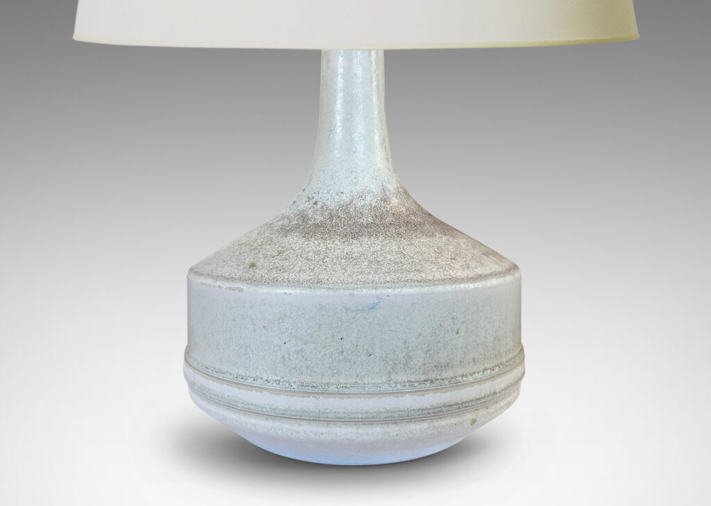 Gallery BAC low drum forms with sprouting tall necks, glazed in mottled very pale gray