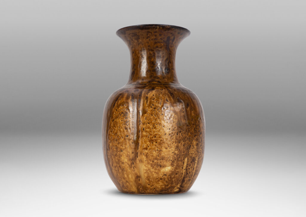 Gallery BAC plump ovoid form with wide flaring neck, glazed in flowing brown tones