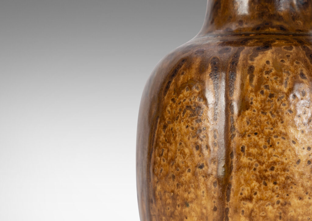 Gallery BAC plump ovoid form with wide flaring neck, glazed in flowing brown tones