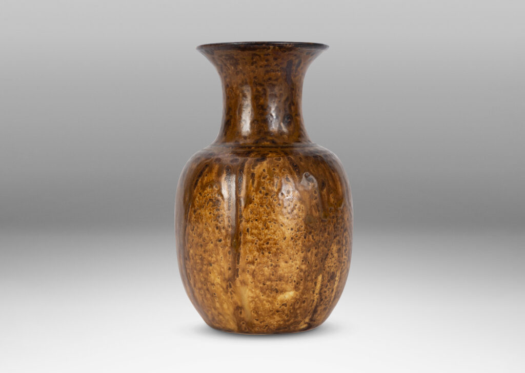 Gallery BAC plump ovoid form with wide flaring neck, glazed in flowing brown tones