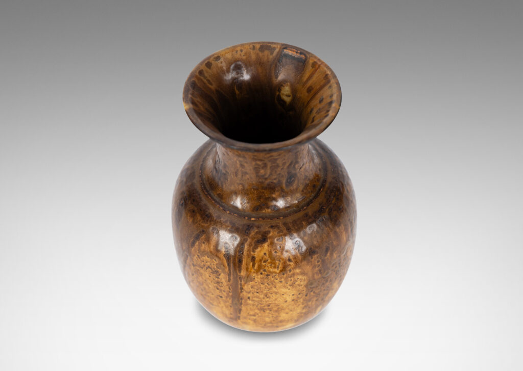 Gallery BAC plump ovoid form with wide flaring neck, glazed in flowing brown tones