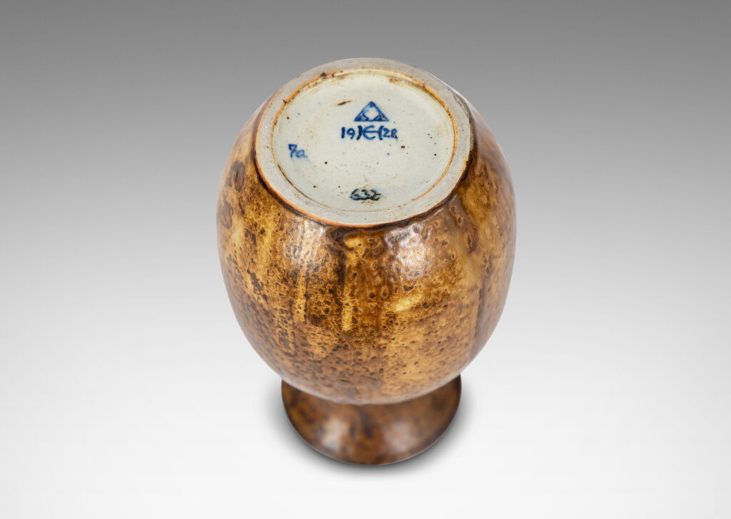 Gallery BAC plump ovoid form with wide flaring neck, glazed in flowing brown tones