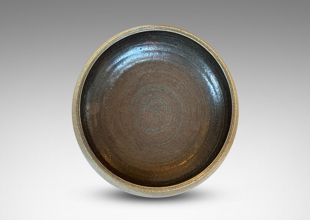 Gallery BAC softly molded sides and a flanged stand, glazed in pale gray and dark brown