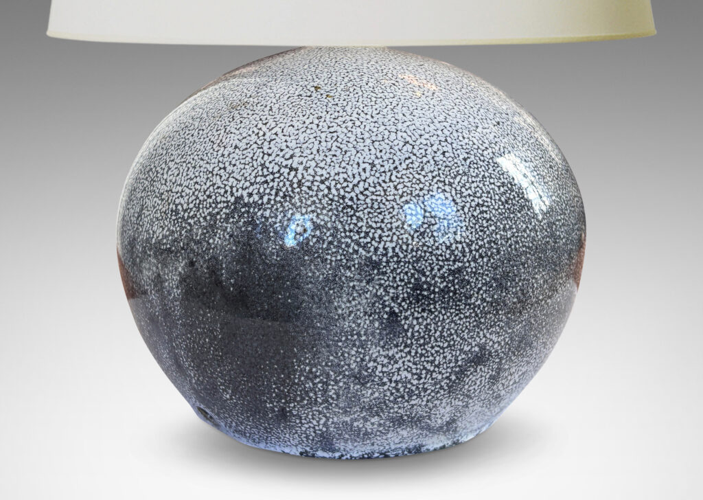 Gallery BAC wide globe form in white with dark gray stipple-glazed earthenware
